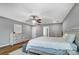 Calm main bedroom features a king-size bed, wood-look floors, and soothing gray walls at 2065 Taney Way, Indian Land, SC 29707