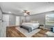Bright main bedroom with a king-size bed, neutral decor, and wood-look floors at 2065 Taney Way, Indian Land, SC 29707