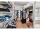 Well-organized walk-in closet with ample shelving and hanging space for clothes and accessories at 2065 Taney Way, Indian Land, SC 29707