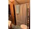 Bathroom featuring a shower and toilet adjacent to the bedroom at 207 Deer Park Rd, Mount Gilead, NC 27306