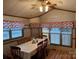 Cozy dining area with wood floors, a chandelier, and a window view at 207 Deer Park Rd, Mount Gilead, NC 27306