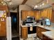 Well-equipped kitchen featuring a range, microwave, and ample counter space at 207 Deer Park Rd, Mount Gilead, NC 27306