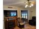 Cozy living room with hardwood floors, an electric fireplace, and views into other rooms at 207 Deer Park Rd, Mount Gilead, NC 27306