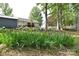Landscaped backyard featuring thriving flowers and a home with a cozy back deck at 216 Dewars Dr, Rock Hill, SC 29730