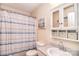 Cozy bathroom with decorative fixtures and a shower featuring striped curtain at 216 Dewars Dr, Rock Hill, SC 29730