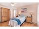 Comfortable main bedroom boasts lots of light, wood floors, and tray ceiling at 216 Dewars Dr, Rock Hill, SC 29730