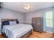 Stylish bedroom with wood floors, ceiling fan, and convenient security safe at 216 Dewars Dr, Rock Hill, SC 29730