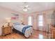 Cozy main bedroom boasts lots of light, wood floors, and ceiling fan at 216 Dewars Dr, Rock Hill, SC 29730