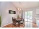 Charming dining area features a modern chandelier and sliding glass doors to the deck at 216 Dewars Dr, Rock Hill, SC 29730
