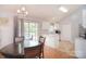Open-concept kitchen/dining area features wood floors, natural light, and stainless steel appliances at 216 Dewars Dr, Rock Hill, SC 29730