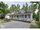 Beautiful home with an expansive front porch, well-kept lawn, and mature trees at 216 Dewars Dr, Rock Hill, SC 29730
