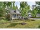 Inviting home with a white picket fence and lovely landscaping around the front porch at 216 Dewars Dr, Rock Hill, SC 29730