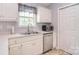 Bright kitchen with stainless steel dishwasher, double sink, and white cabinets at 216 Dewars Dr, Rock Hill, SC 29730