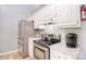 Well-equipped kitchen boasts stainless steel appliances, white cabinets, and ample counter space at 216 Dewars Dr, Rock Hill, SC 29730