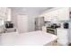Bright kitchen featuring white cabinetry, stainless steel appliances, and an eat-in counter at 216 Dewars Dr, Rock Hill, SC 29730