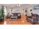 Cozy living room featuring hardwood floors, vaulted ceilings, and comfortable leather furniture at 216 Dewars Dr, Rock Hill, SC 29730