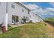Spacious backyard featuring a patio, green lawn, and privacy fence; ideal for relaxation at 23112 Clarabelle Dr, Charlotte, NC 28273