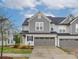 Charming townhome with a well-manicured lawn and a two-car garage provides appealing curb appeal at 23112 Clarabelle Dr, Charlotte, NC 28273