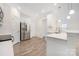 Bright and open kitchen with stainless steel appliances, white cabinets and a large sink at 23112 Clarabelle Dr, Charlotte, NC 28273