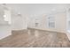 Spacious living room featuring neutral walls, wood-look floors, and plenty of natural light at 23112 Clarabelle Dr, Charlotte, NC 28273