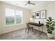 Office space with a dark desk and modern decor pieces with natural light from the window at 23112 Clarabelle Dr, Charlotte, NC 28273