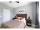 Bedroom features a comfortable bed, neutral tones, and ample natural light at 234 Deal Estate Dr, China Grove, NC 28023