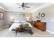 Comfortable bedroom features a ceiling fan, lamps, and decor at 234 Deal Estate Dr, China Grove, NC 28023