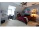 Bedroom includes a desk, bed, and ceiling fan at 234 Deal Estate Dr, China Grove, NC 28023