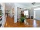 Bright hallway with hardwood floors leading to the living room and kitchen area at 234 Deal Estate Dr, China Grove, NC 28023