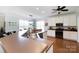 Well-lit kitchen featuring a breakfast bar, stainless sink, and bright overhead lights at 234 Deal Estate Dr, China Grove, NC 28023