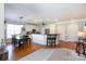 Open-concept kitchen and dining area with stainless appliances and hardwood floors at 234 Deal Estate Dr, China Grove, NC 28023