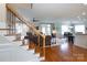 Cozy living room featuring hardwood floors, open layout, and staircase at 234 Deal Estate Dr, China Grove, NC 28023