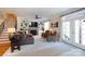 Spacious living room featuring a fireplace, built-in shelving, and access to outdoor space at 234 Deal Estate Dr, China Grove, NC 28023