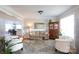 Inviting living room with hardwood floors, neutral paint, and an open view to the dining area at 234 Deal Estate Dr, China Grove, NC 28023