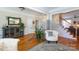 Bright living room with hardwood floors, accent furniture, and large potted plant at 234 Deal Estate Dr, China Grove, NC 28023
