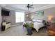 Large main bedroom with a tray ceiling, a TV, and generous natural light at 234 Deal Estate Dr, China Grove, NC 28023