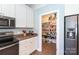 Kitchen with a view into a well-stocked walk-in pantry for ample food storage at 234 Deal Estate Dr, China Grove, NC 28023