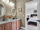 Bathroom features granite countertops, dual sinks, and an open view of the adjacent bedroom at 2553 Fallbrook Nw Pl, Concord, NC 28027