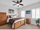 Bright bedroom with a wooden bed, natural light, and simple decor at 2553 Fallbrook Nw Pl, Concord, NC 28027