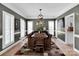 Elegant dining room featuring a wood table, modern lighting, and stylish decor at 2553 Fallbrook Nw Pl, Concord, NC 28027