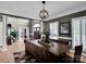 Open concept dining area with hardwood floors and views into the entry of the home at 2553 Fallbrook Nw Pl, Concord, NC 28027
