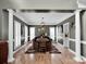 Elegant dining room featuring hardwood floors and large windows that offer natural light at 2553 Fallbrook Nw Pl, Concord, NC 28027