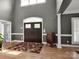 Grand entry featuring wood floors and a view of the double door entry at 2553 Fallbrook Nw Pl, Concord, NC 28027