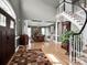 Grand foyer featuring hardwood floors, staircase, and open view to the dining room at 2553 Fallbrook Nw Pl, Concord, NC 28027