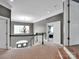 Upstairs hallway with neutral walls and doors to different rooms at 2553 Fallbrook Nw Pl, Concord, NC 28027
