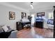 Comfortable home office space with ample lighting and hardwood floors at 2553 Fallbrook Nw Pl, Concord, NC 28027