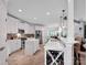 Bright kitchen with white cabinets, stainless steel appliances, an island and a built-in wine rack at 2553 Fallbrook Nw Pl, Concord, NC 28027