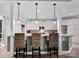 Kitchen with bar seating, an island and stainless steel appliances at 2553 Fallbrook Nw Pl, Concord, NC 28027