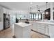 Open concept kitchen with stainless steel appliances and island at 2553 Fallbrook Nw Pl, Concord, NC 28027