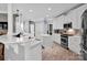 Bright kitchen with an island, bar seating and stainless steel appliances at 2553 Fallbrook Nw Pl, Concord, NC 28027